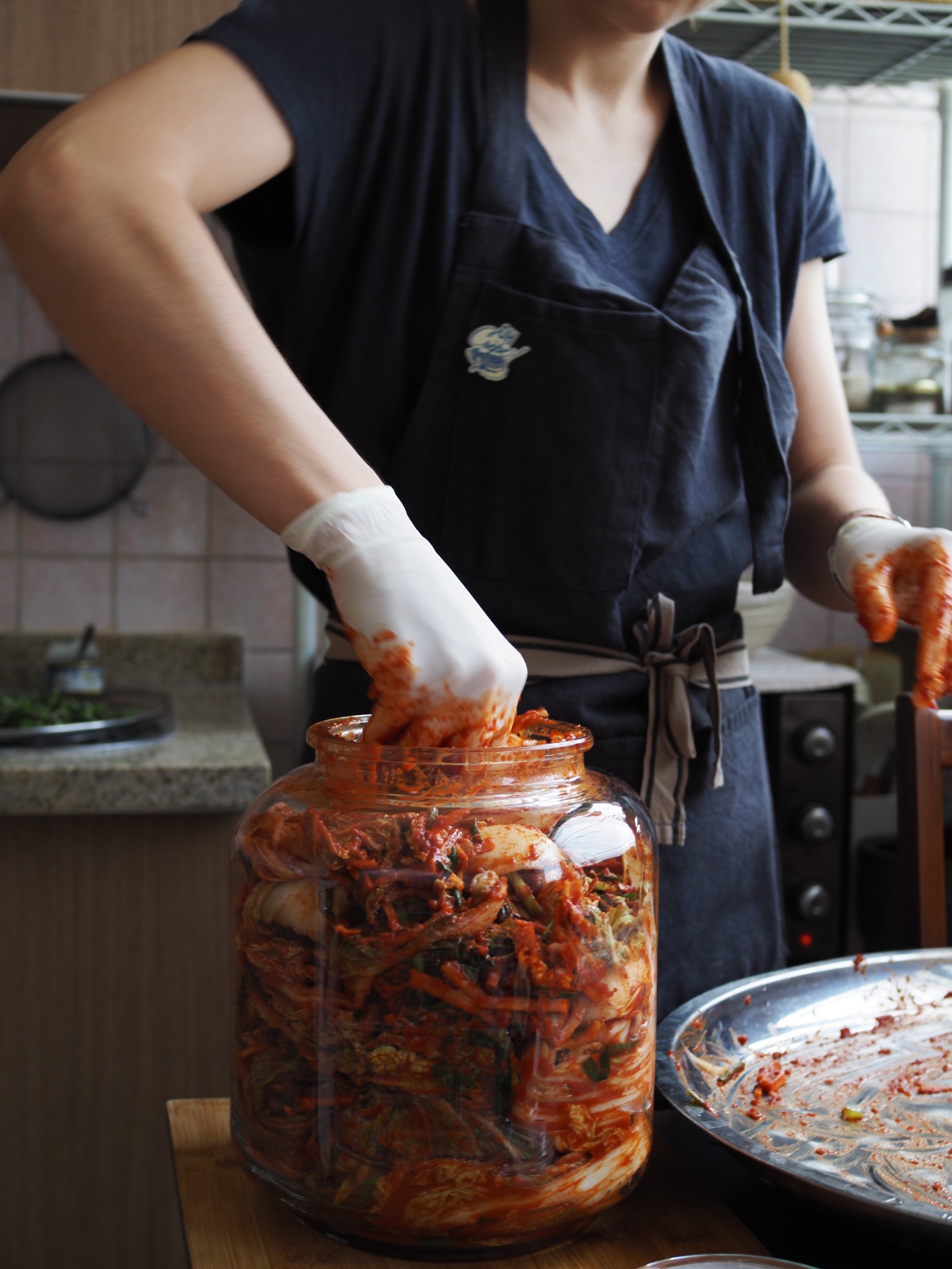Finished kimchi packed tightly into a glass jar